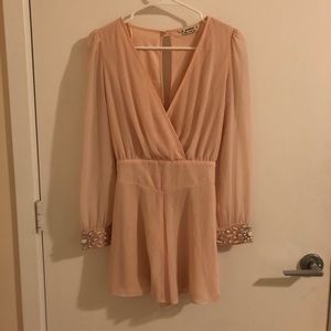 Peachy romper with embellishments